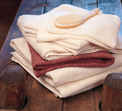 Organic, unbleached bath sheets by Indigenous Design (650-568-7360, www.indigenousdesign.com) and naturally dyed Indika towels (866-446-3452, www.indikahome.com) are soft, absorbent—and healthy. This rustic wood bench brings an earthy element into the bath.